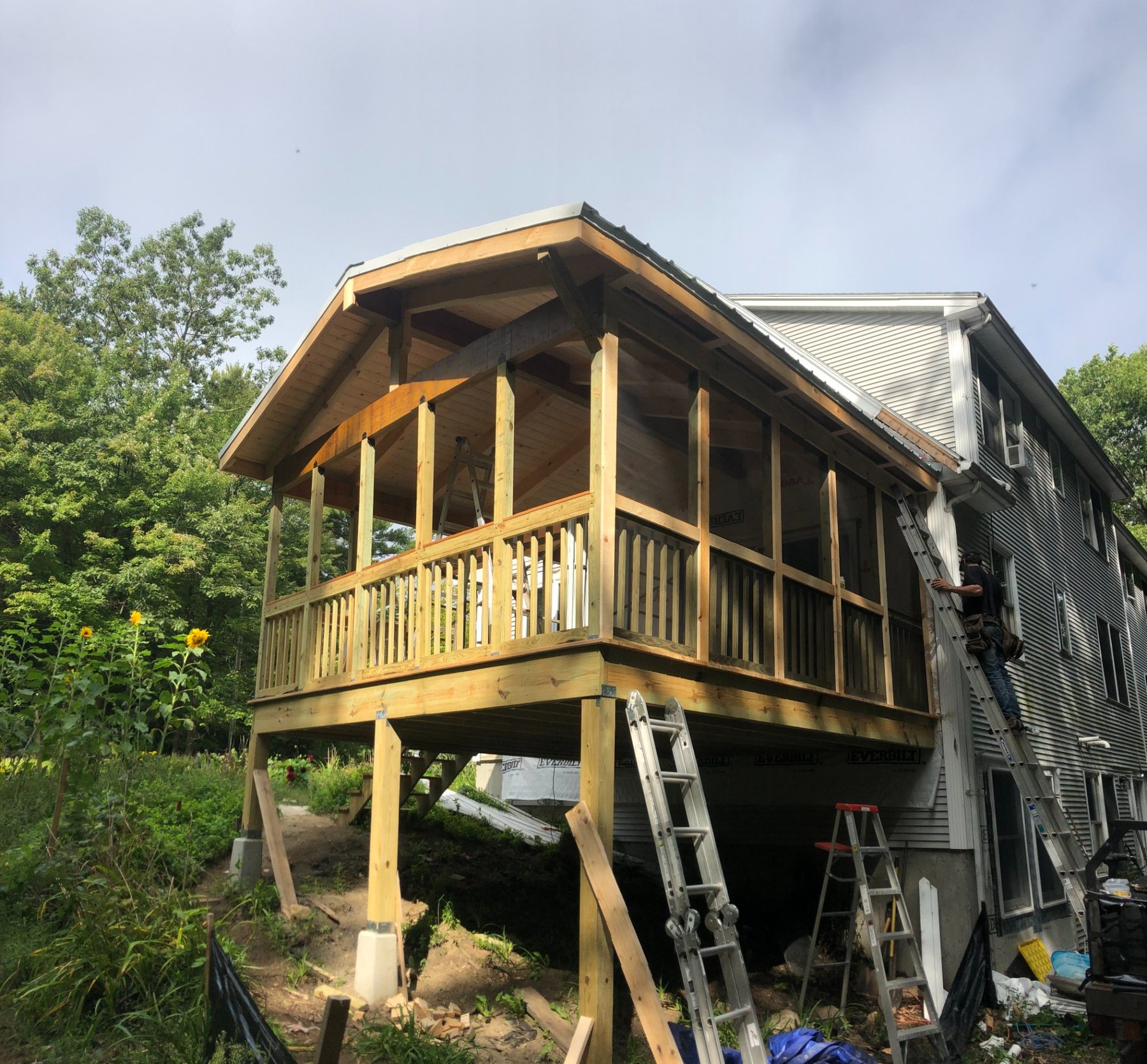 Large custom screened porch under construction